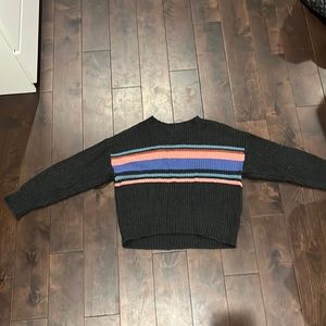 Dark grey sweater with colorful strips